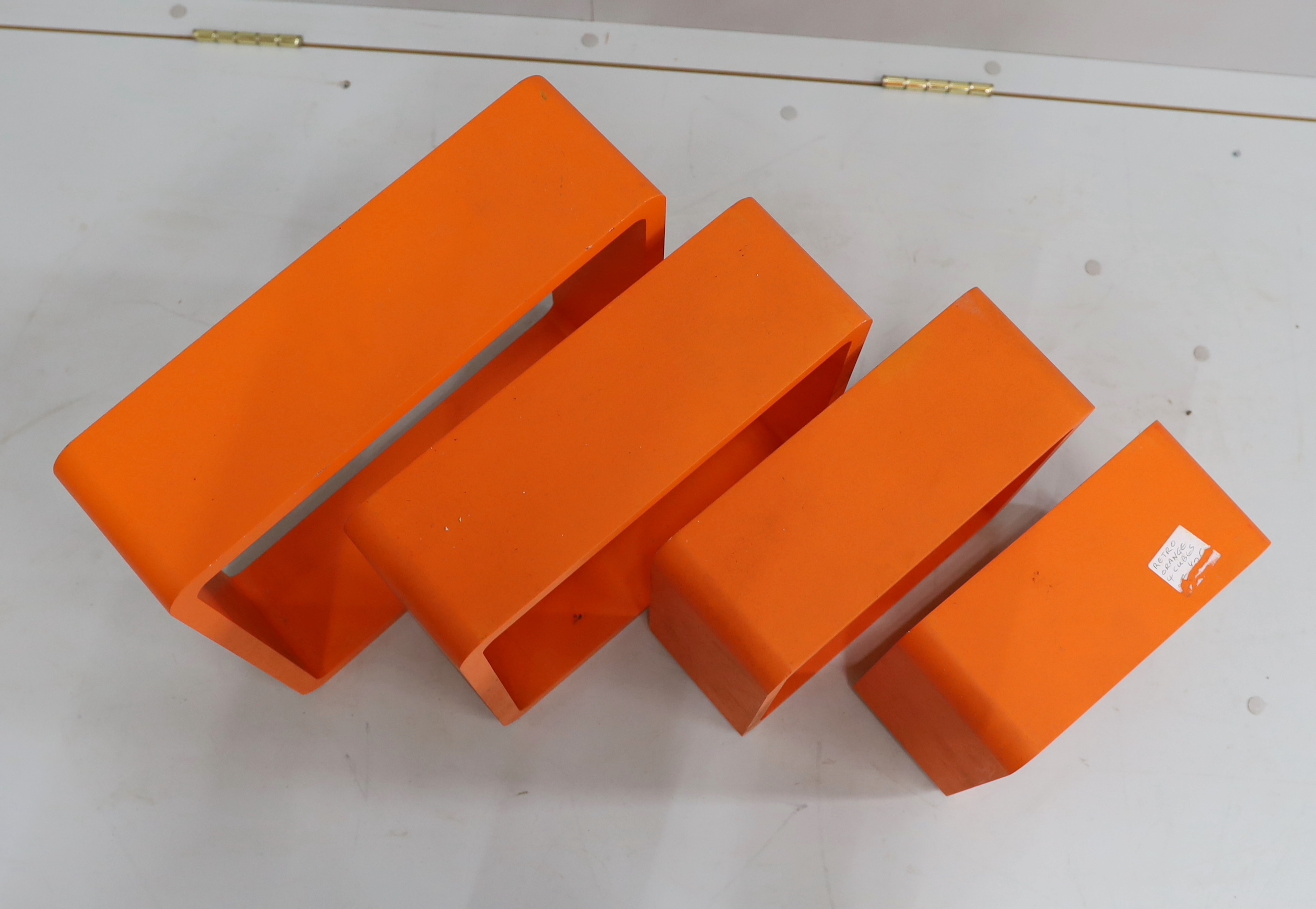 A set of four contemporary wall shelves, largest 41cm